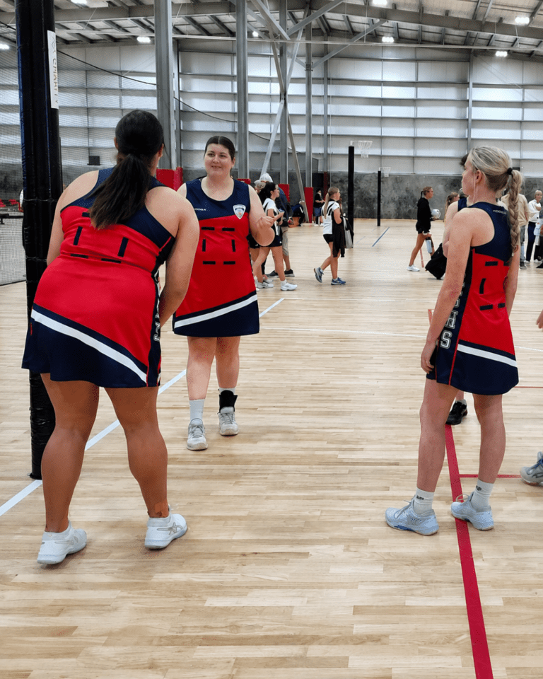 women playing netball in a netball dress from KOOGA