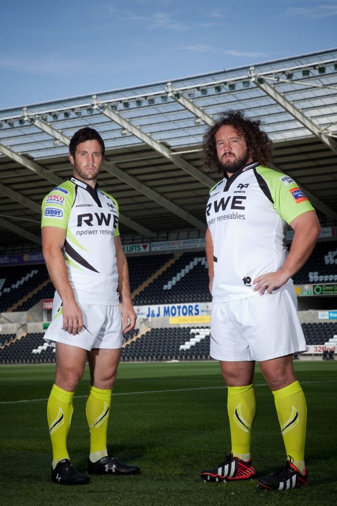 Football players wearing custom sublimated teamwear with vibrant full-colour designs, showcasing the durability and performance of sublimation printing for modern sports teams.