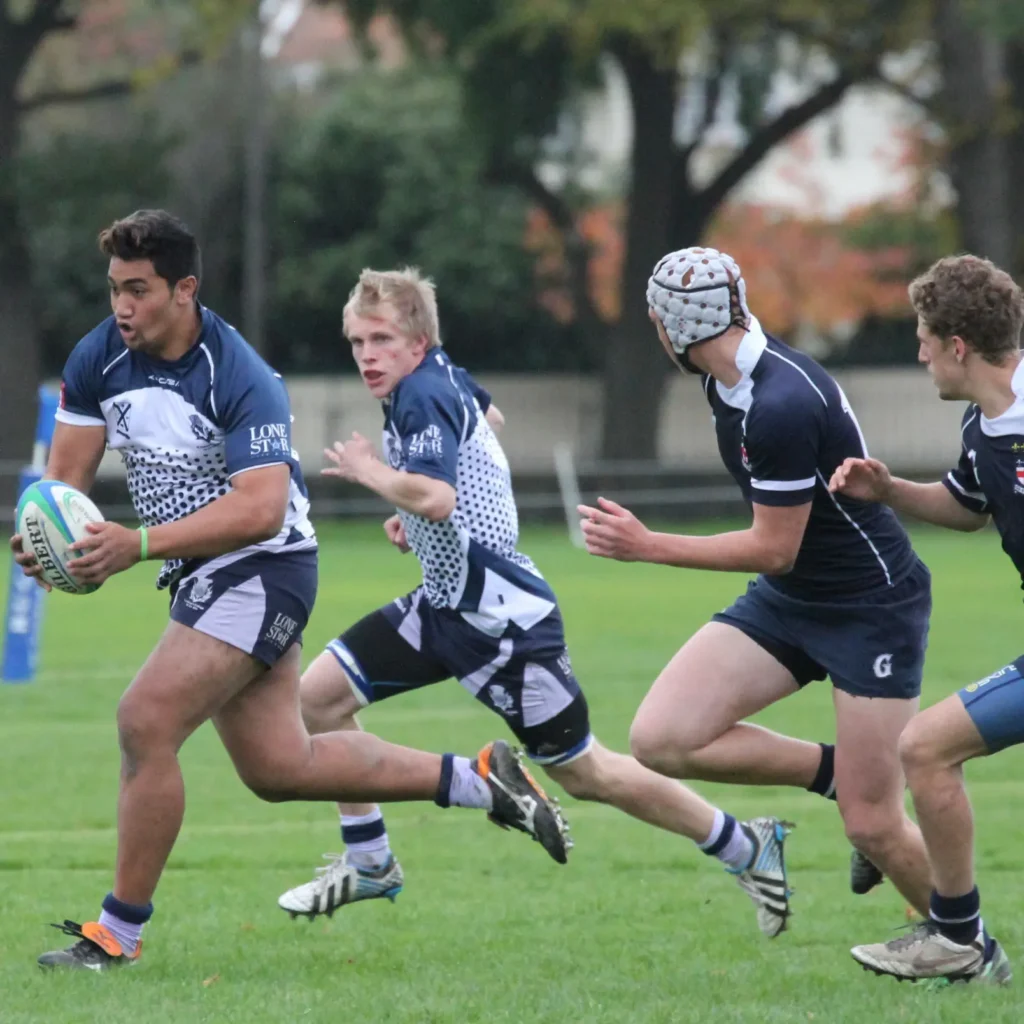 men-running-in-rugby-sport-wearing-kooga-uniform